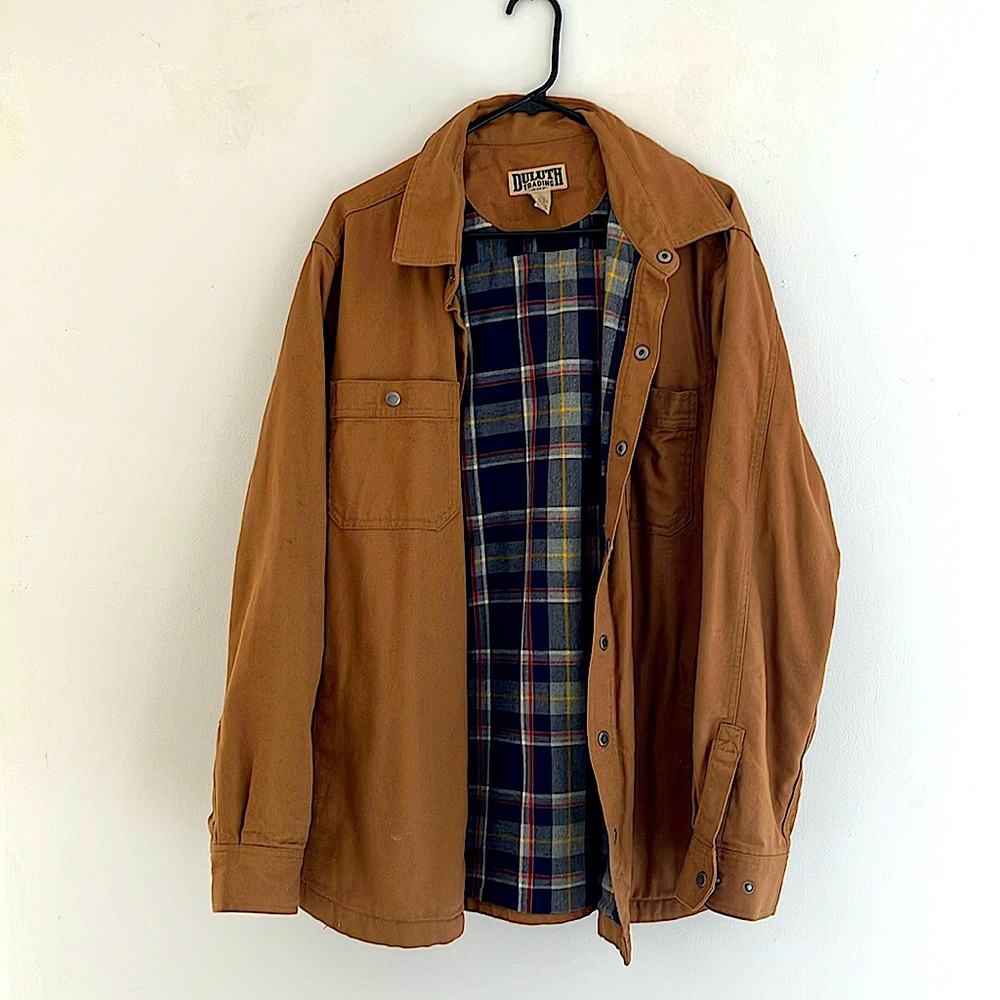 Lightly worn, runs a little long, very well made, inside pockets, big pockets